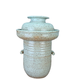 fermentation Ceramic pot with textured surface on a white background