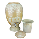 handmade ceramic water pot with crystalline glaze on a white background