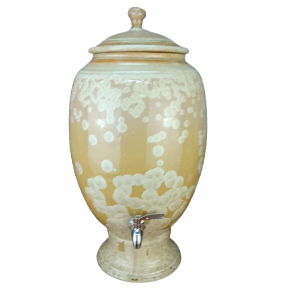 Decorative ceramic water pot with crystalline gold glaze and a spout on a white background.