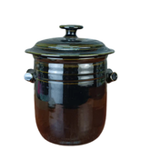 Ceramic pot with a lid on a white background