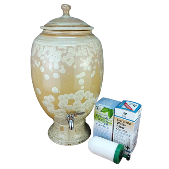 Ceramic water dispenser with a filter candle and packaging on a white background