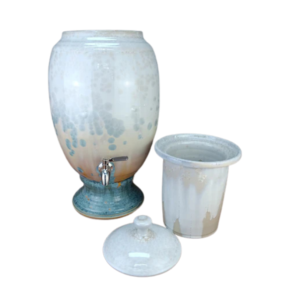 Ceramic water dispenser with a ceramic insert on a white background