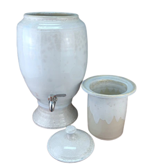 White ceramic drink dispenser with handmade insert and lid  on a white background